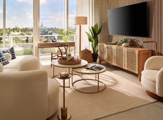 a living room with a television and a table