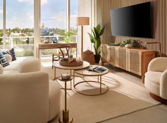 a living room with a television and a table