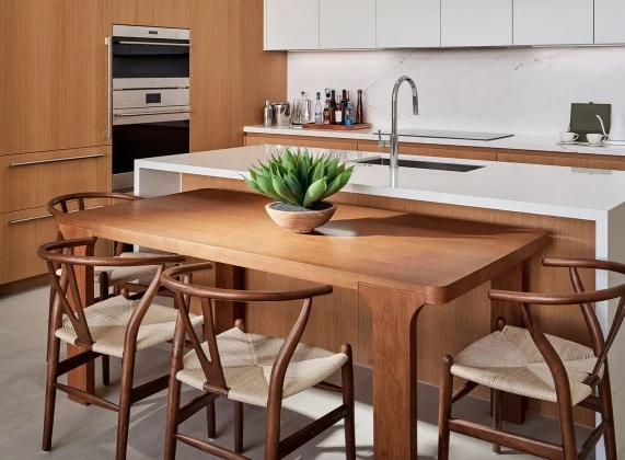 a kitchen with a table and chairs