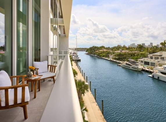 a balcony with a view of a river and a city