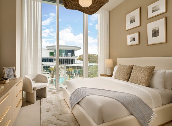 a bedroom with a large window