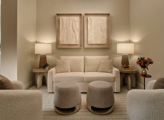 a room with a couch and two chairs