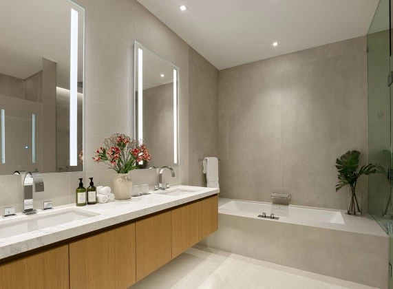 a bathroom with a tub and sink