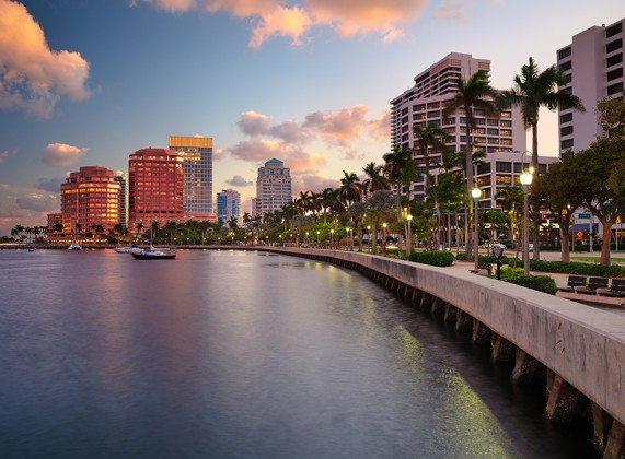 a body of water with a body of water and a city with tall buildings