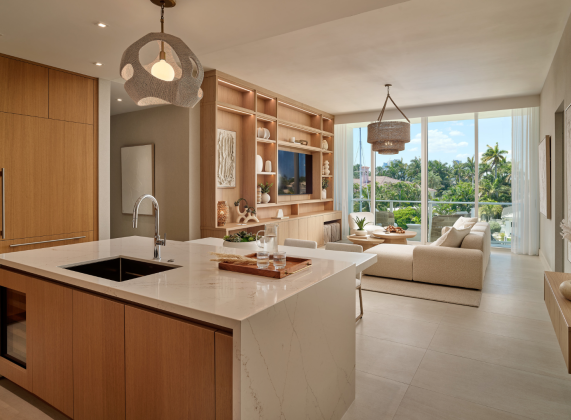 a kitchen and living room with a large window