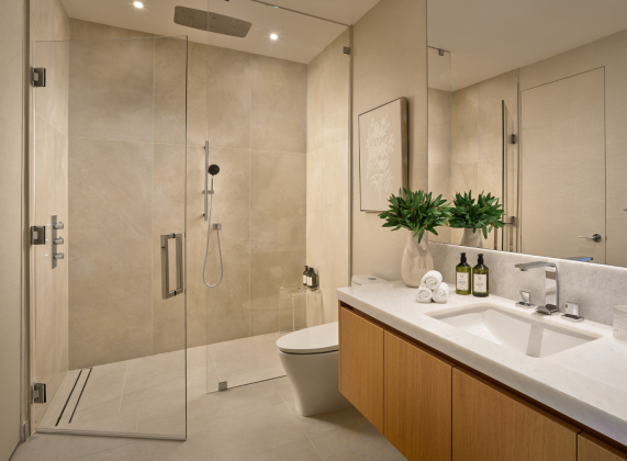 a bathroom with a glass shower and sink