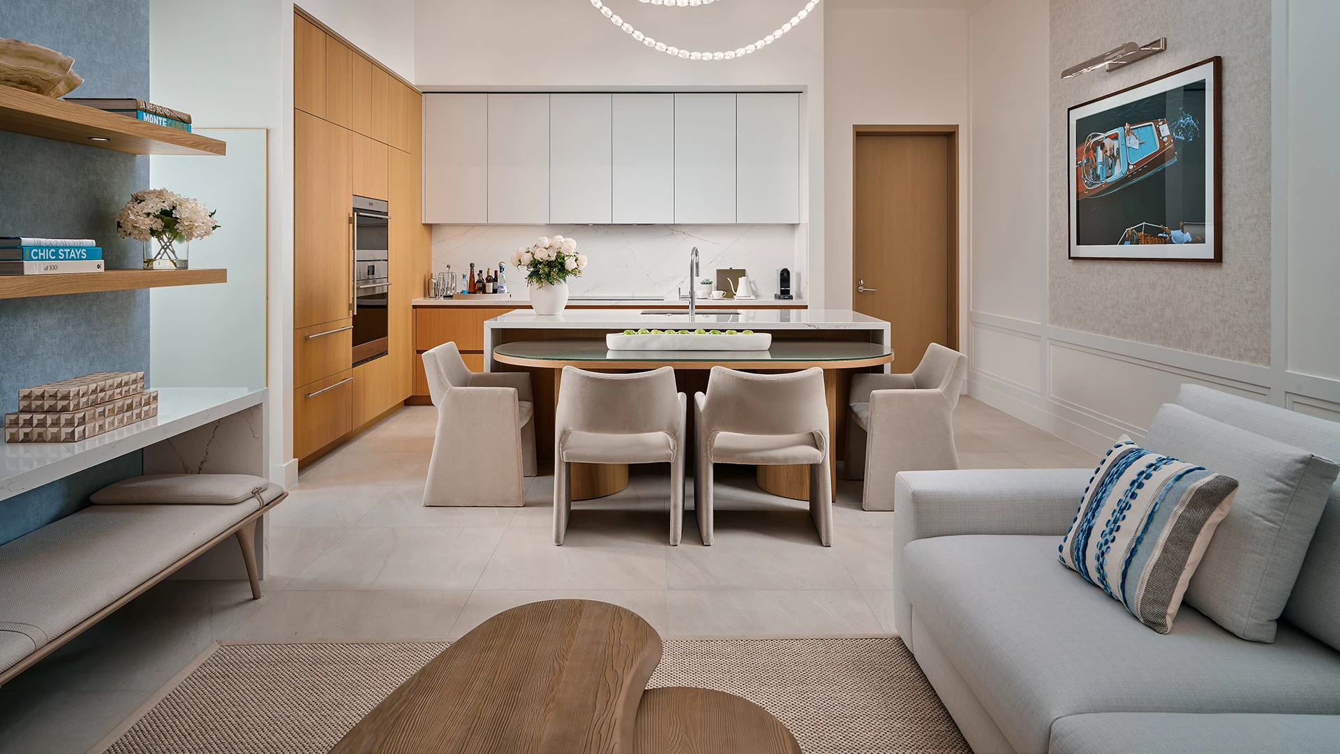 a kitchen and dining room with a table and chairs