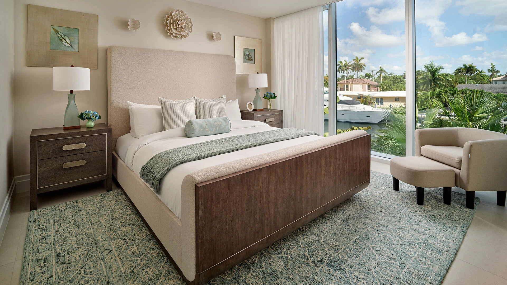 a bedroom with a bed and a glass door