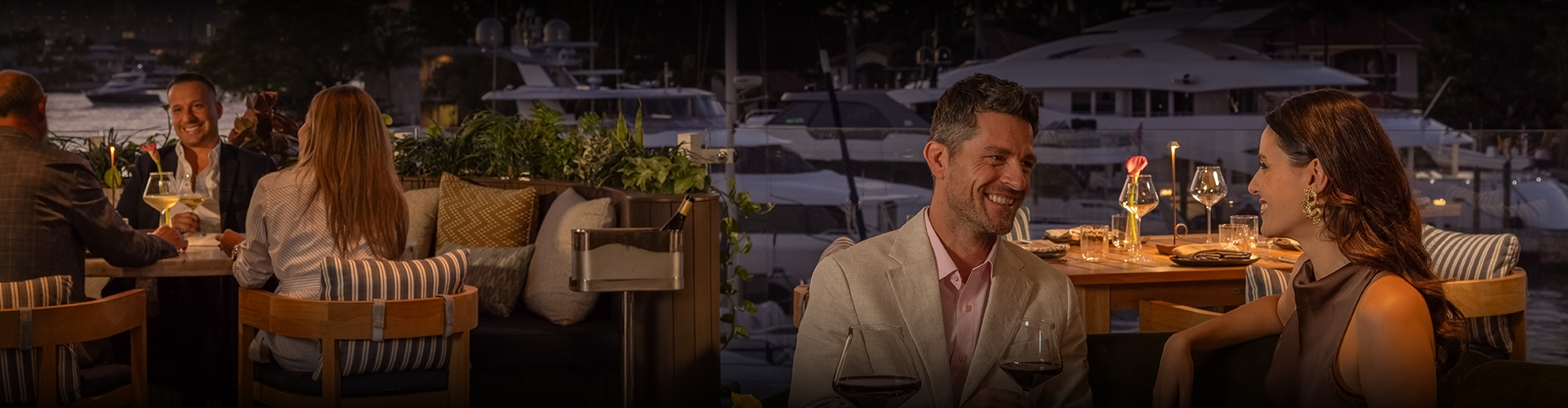 a man laughing at a wine bottle