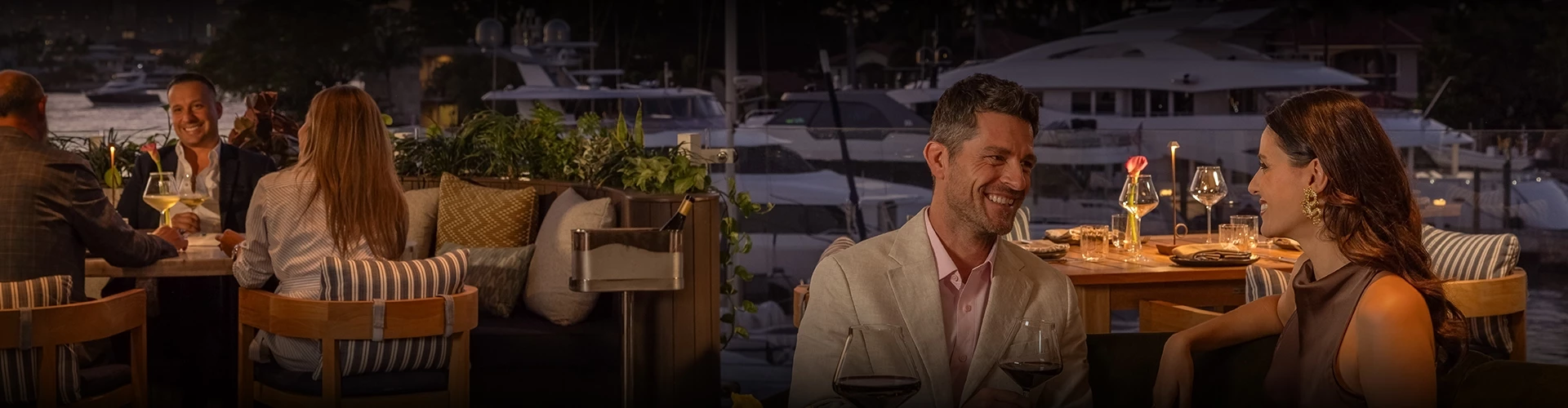 a man laughing at a wine bottle