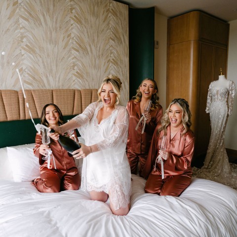 a group of women on a bed