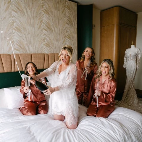 a group of women on a bed