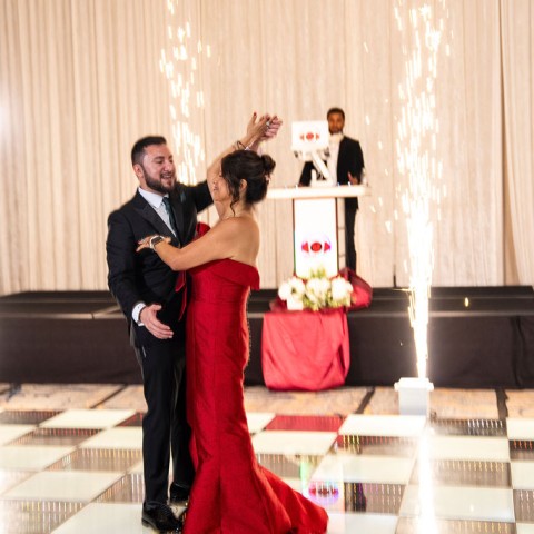 a man and woman dancing in a dance floor