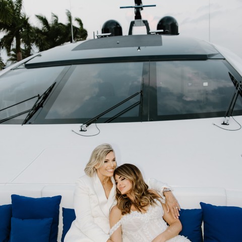 two women sitting on a boat