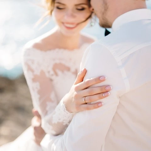 a man and woman holding hands