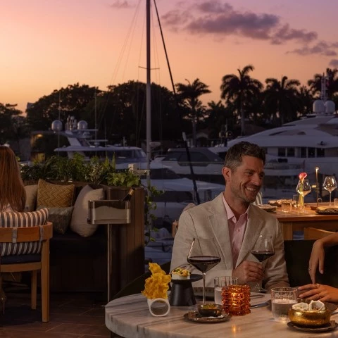 a group of people sitting at a table with drinks