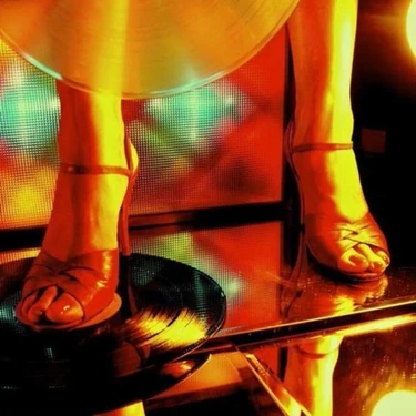 a close-up of a woman's feet on a record