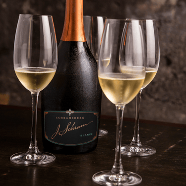 a bottle of wine and glasses