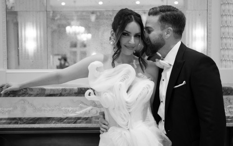 a man kissing a woman in a white dress