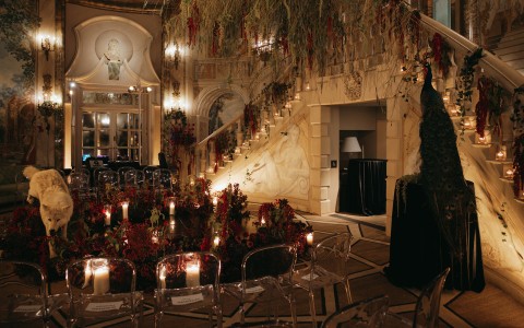 a room with chairs and flowers