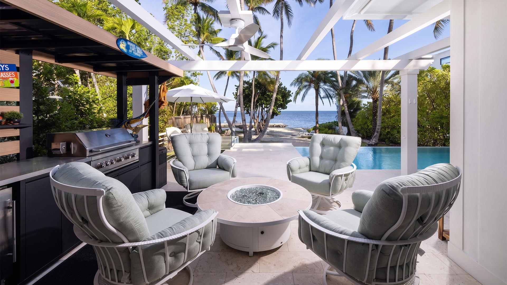 a patio with chairs and a pool