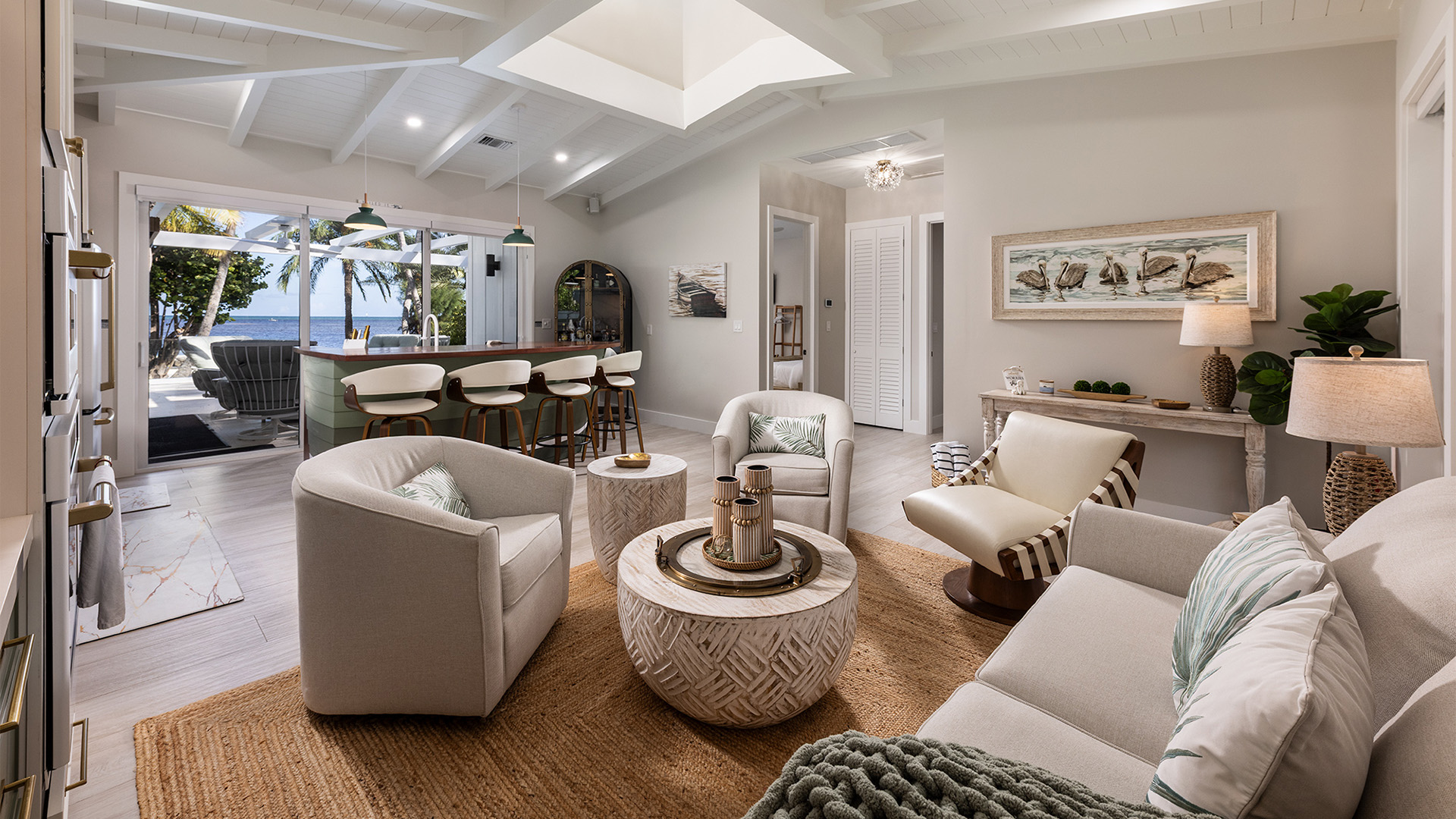 a living room with a kitchen and dining area