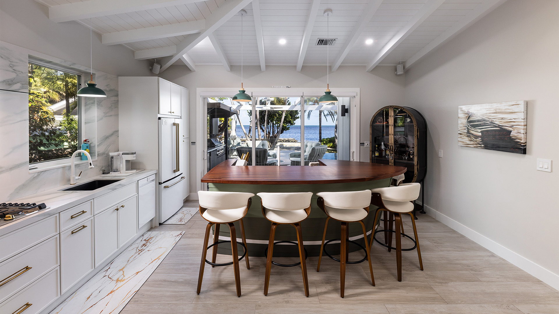 a kitchen with a bar and chairs