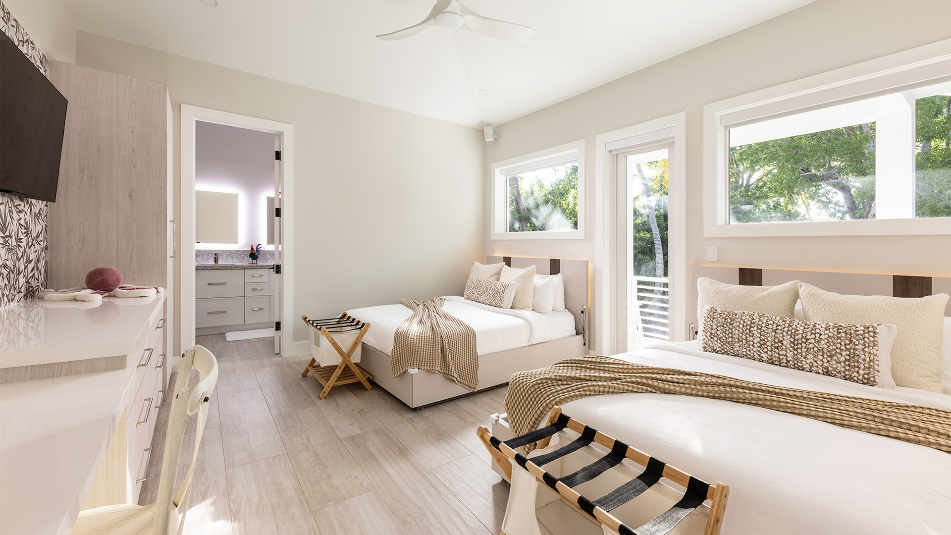 a bedroom with two beds and a sink
