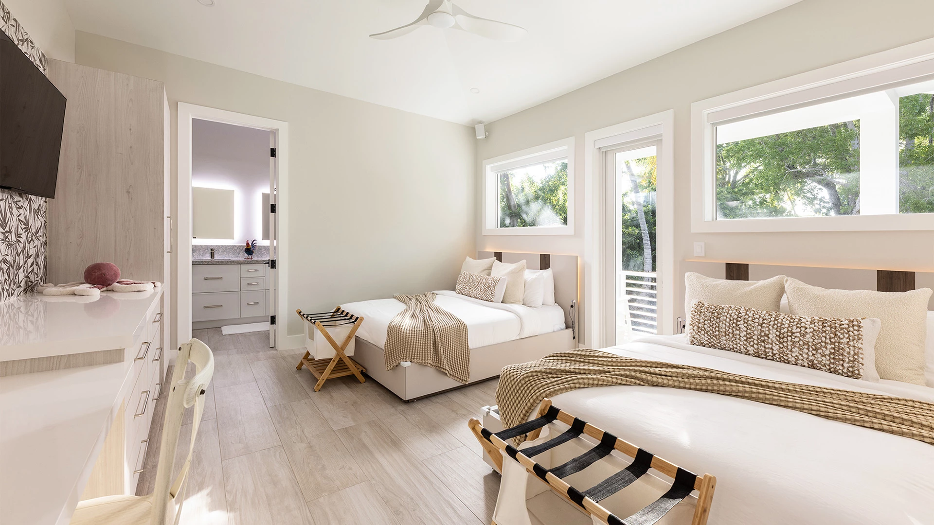 a bedroom with two beds and a sink
