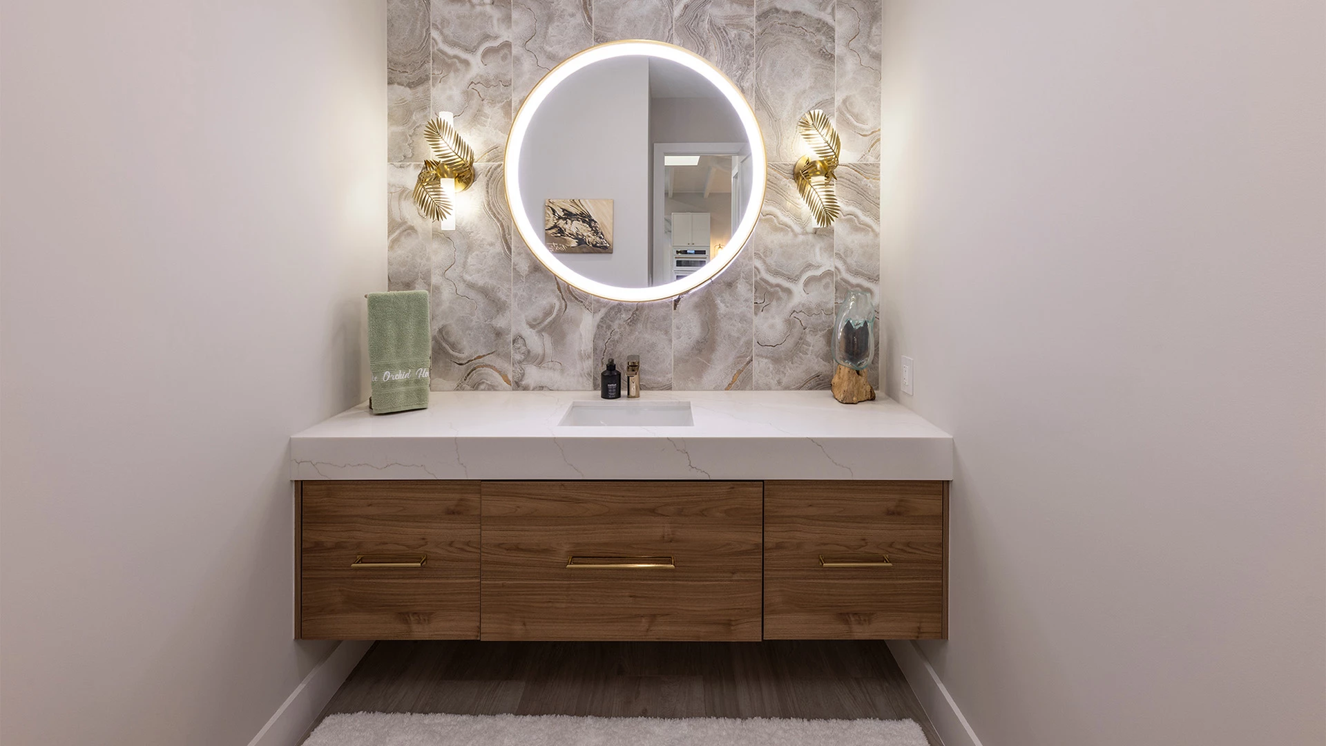 a bathroom with a round mirror