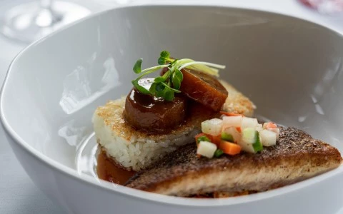 a bowl of food with meat and rice