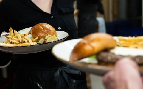a person holding a plate of food