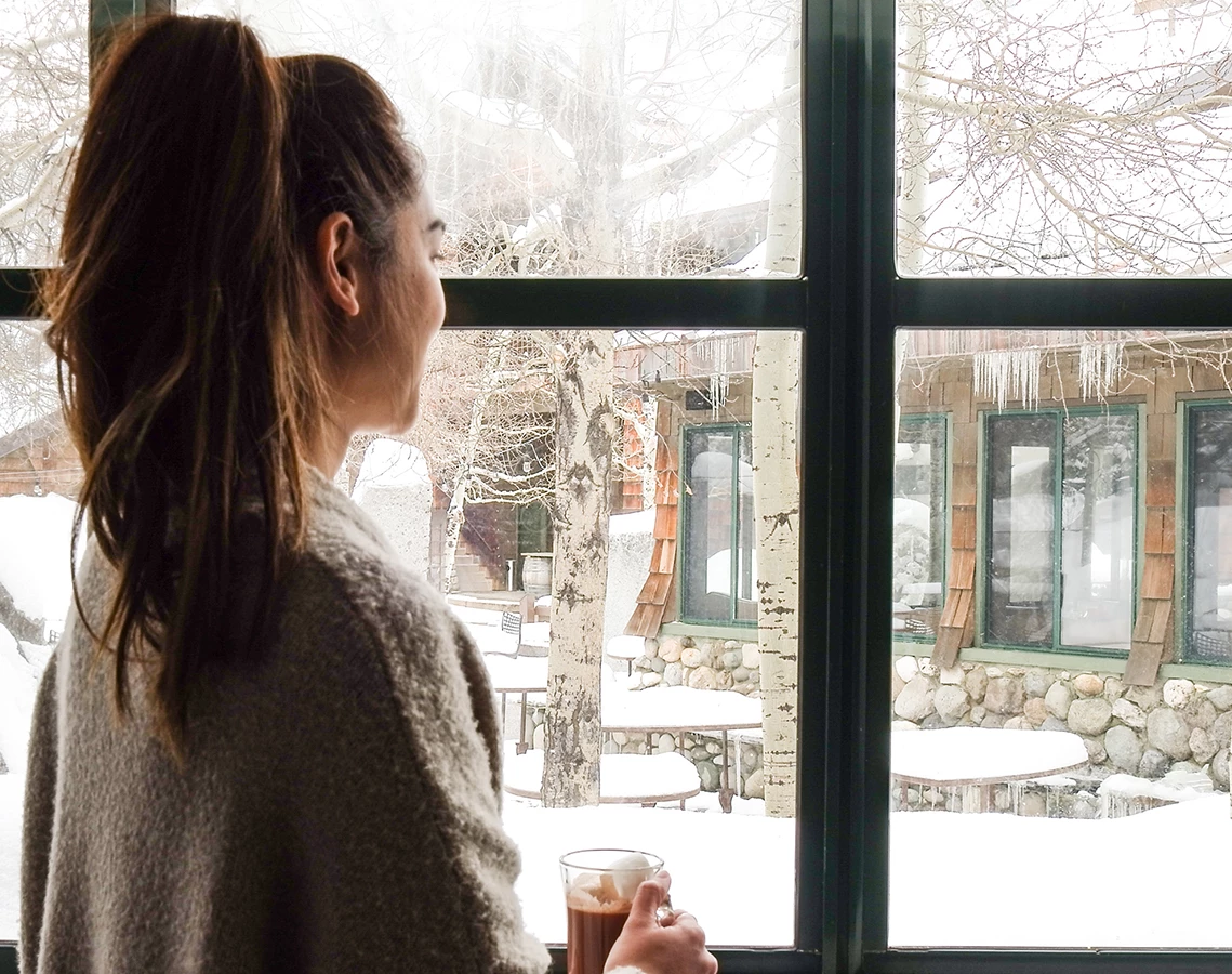 a woman looking out a window
