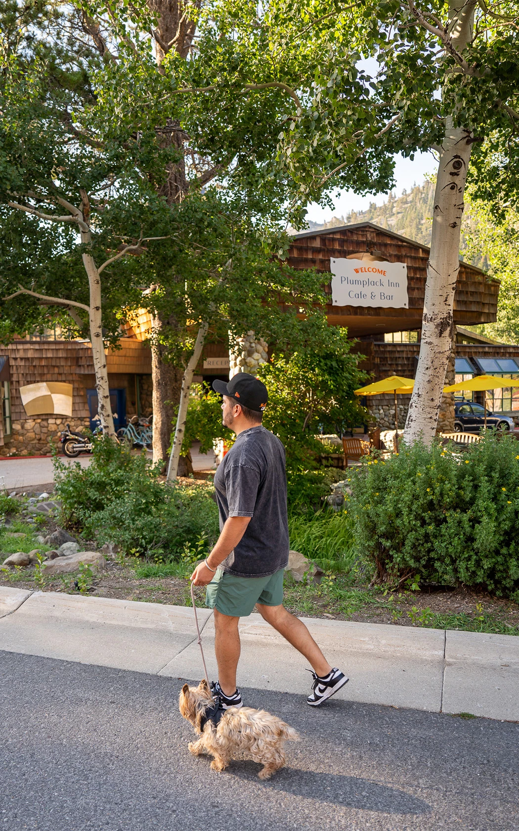 a man walking on a sidewalk