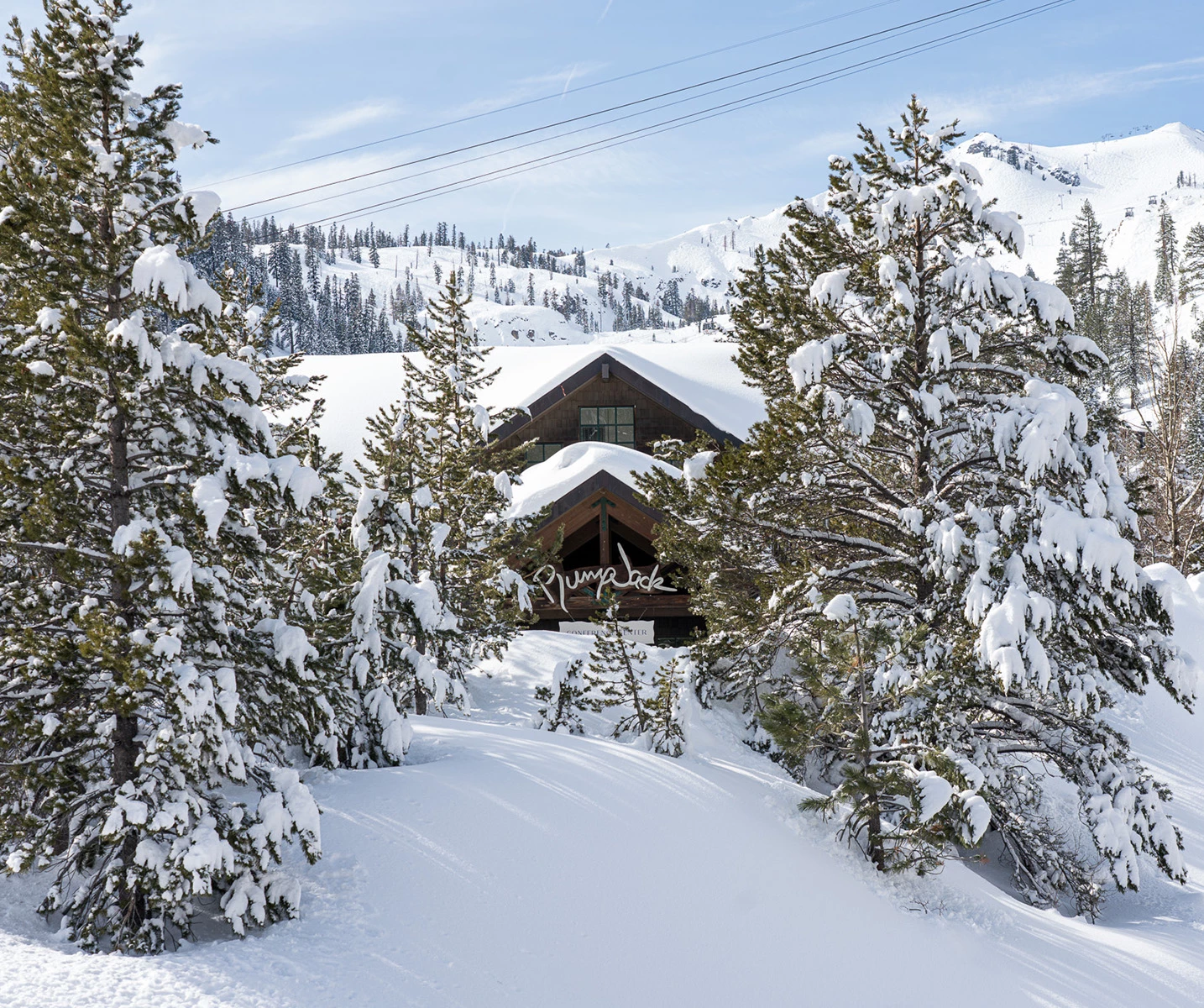 a house surrounded by snow