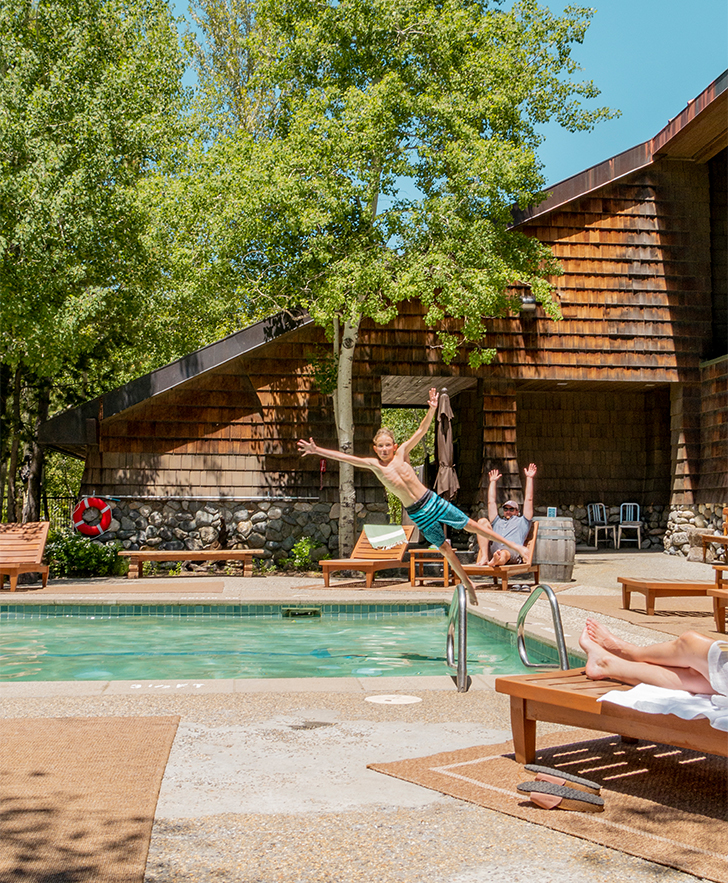 a man jumping into a pool