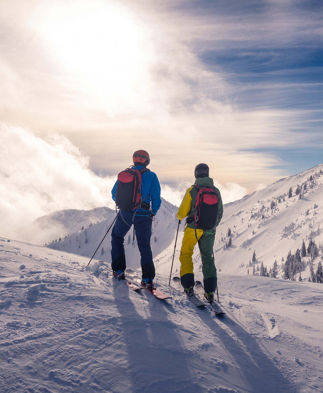 two people skiing on a snowy mountain