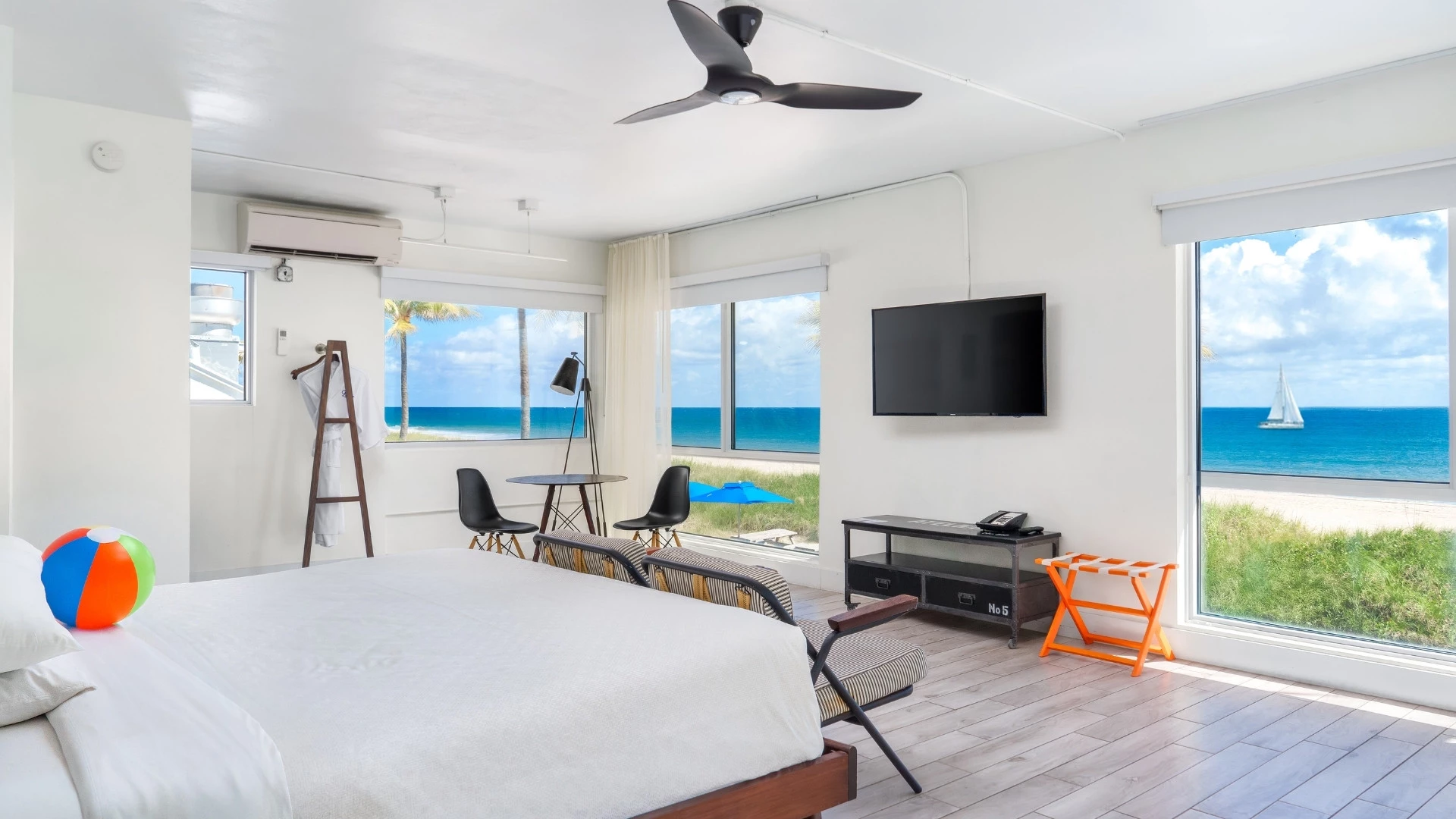 a room with a bed and a television and a table