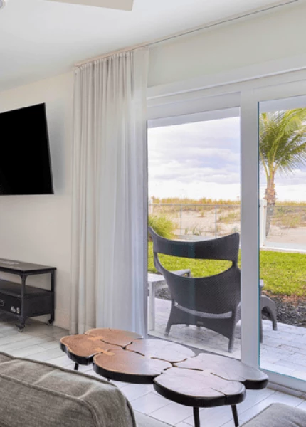 a room with a glass door and a table