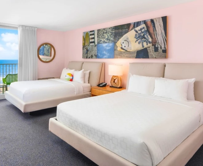 a room with two beds and a table