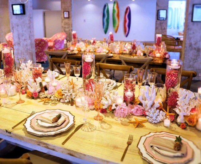 a table with candles and flowers