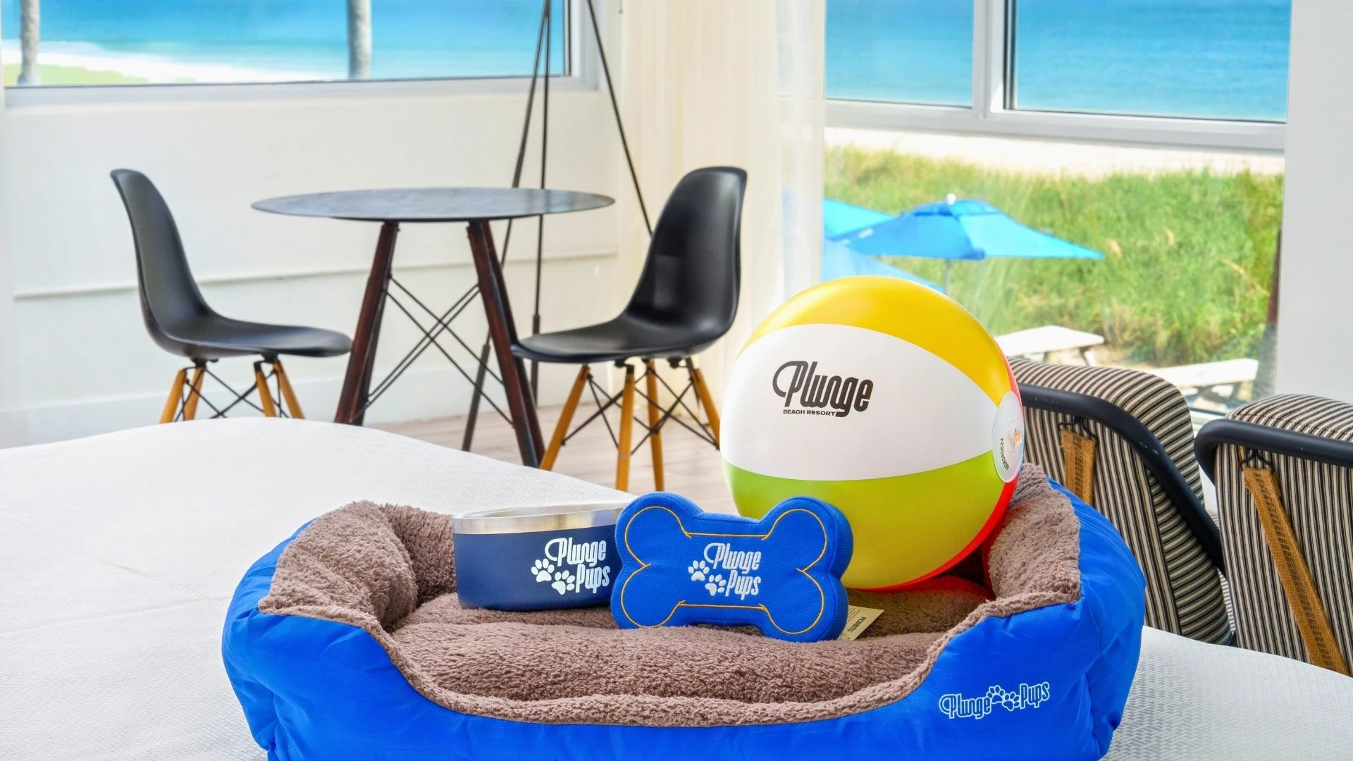a dog bed with a ball and a dog bone