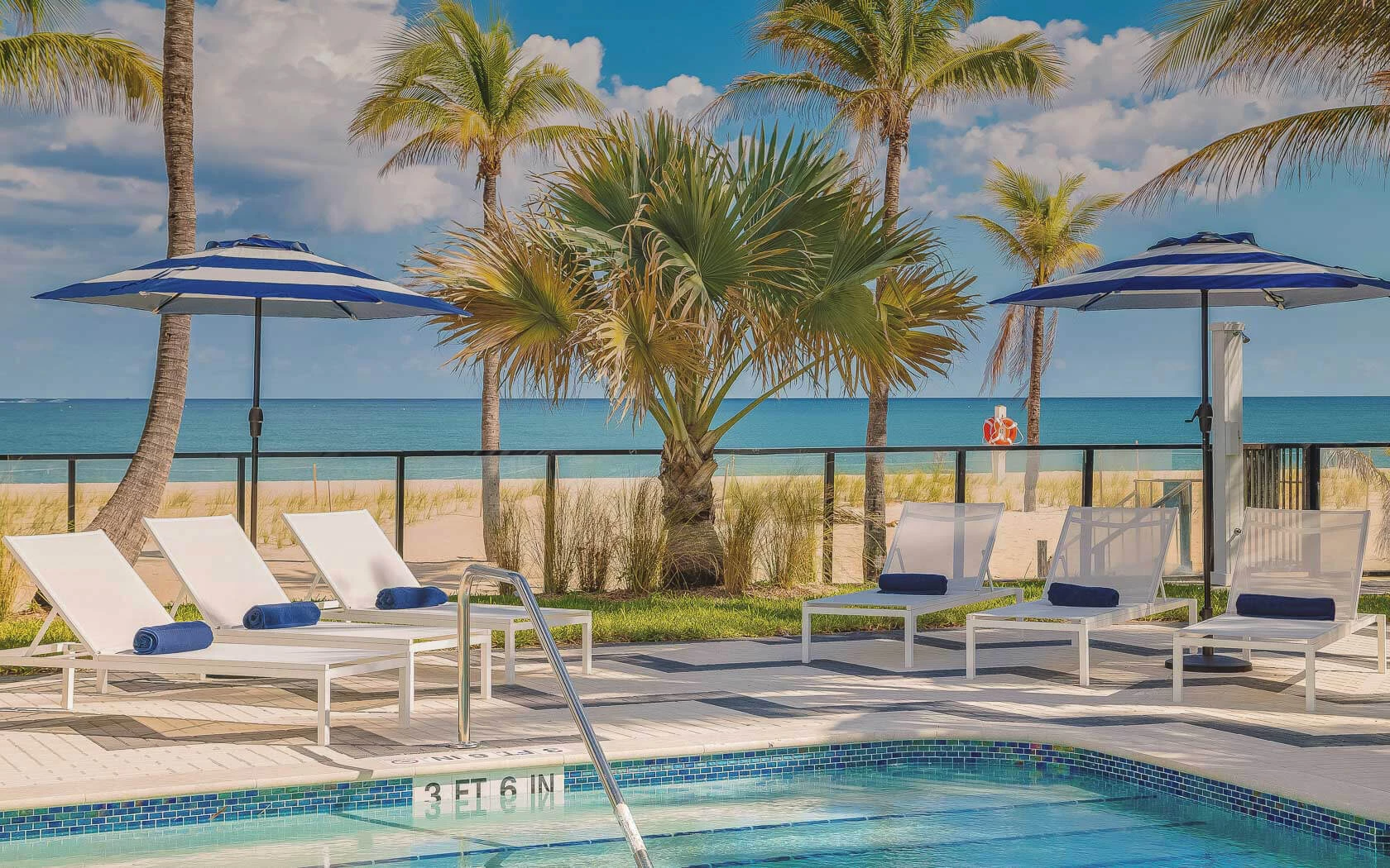 Outdoor pool with a view of the beach