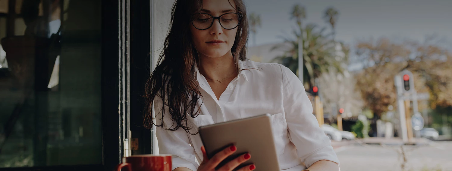 woman reading her tablet 