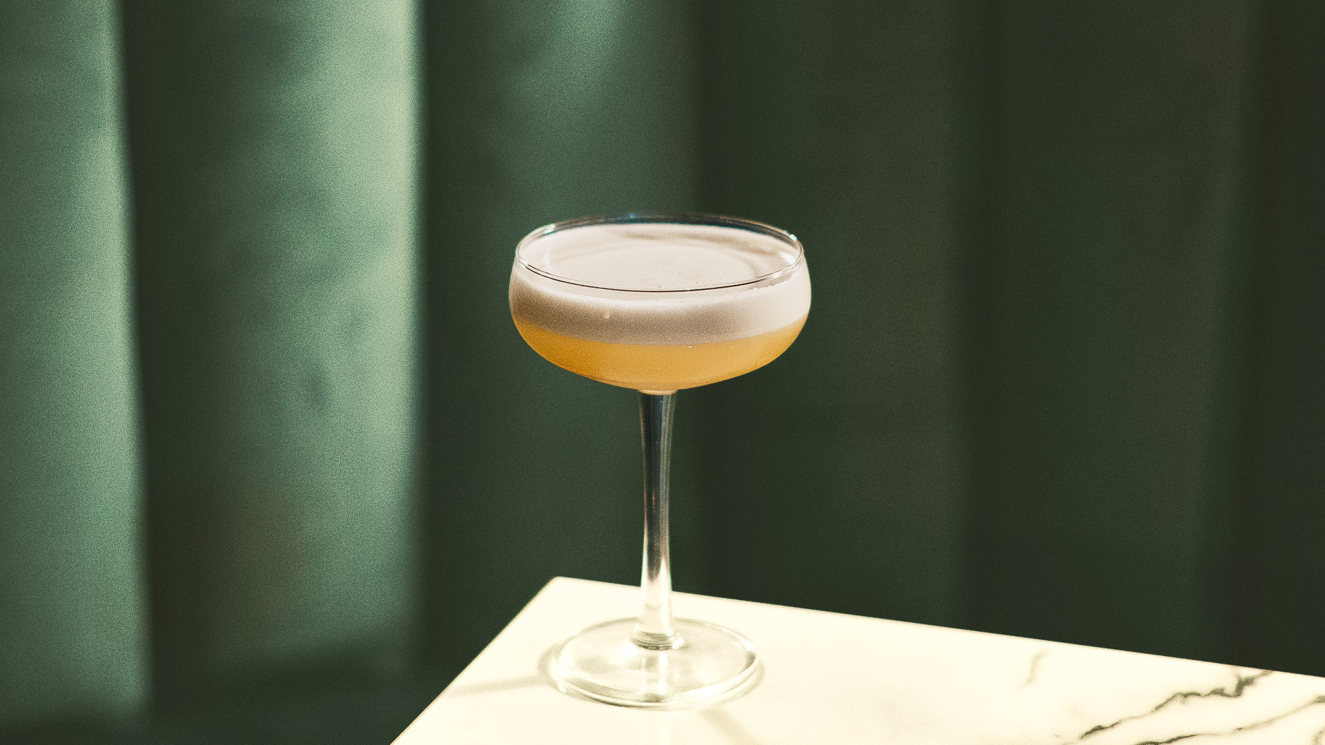 a glass with a drink in it