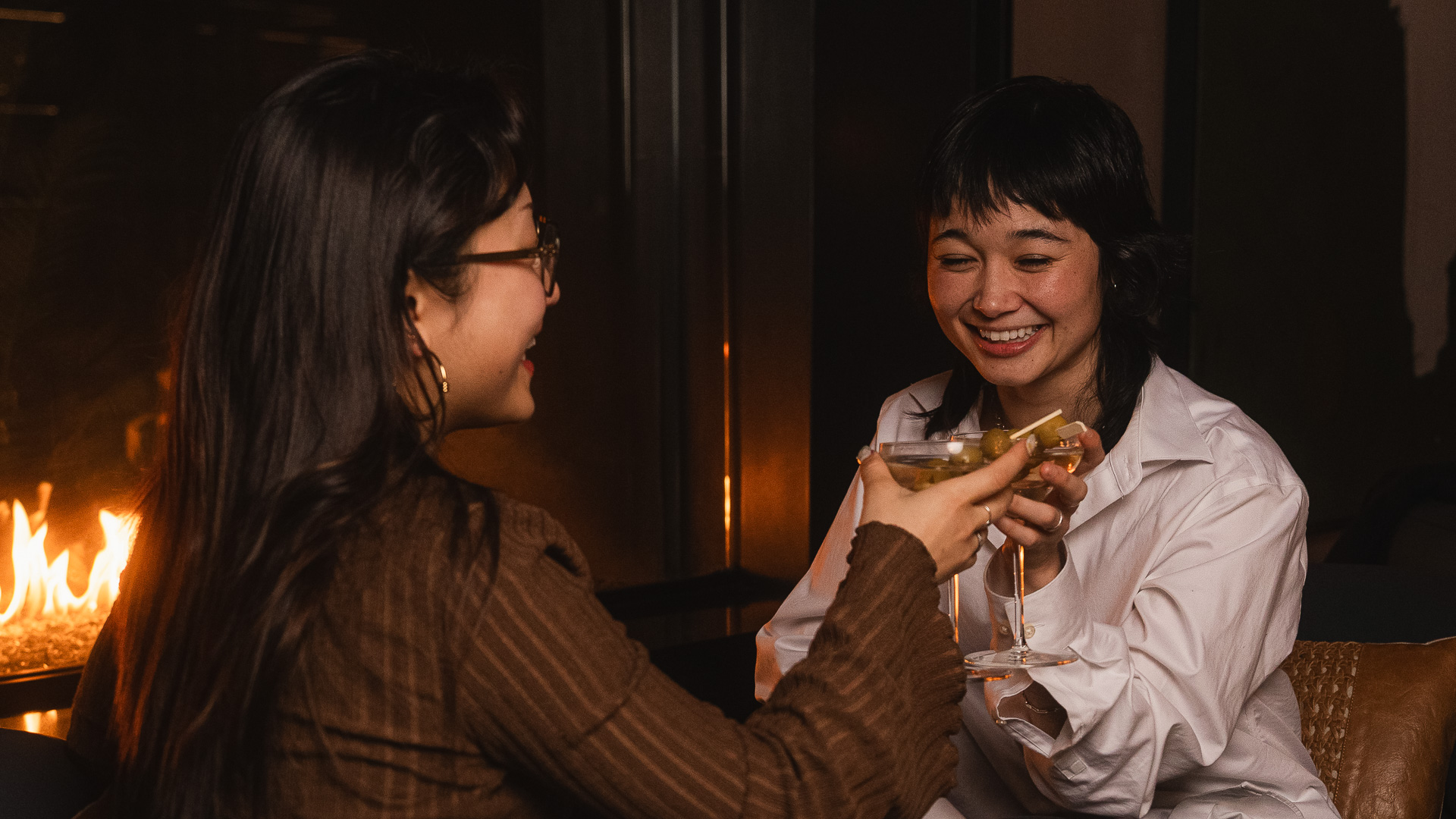 a woman holding a glass of wine
