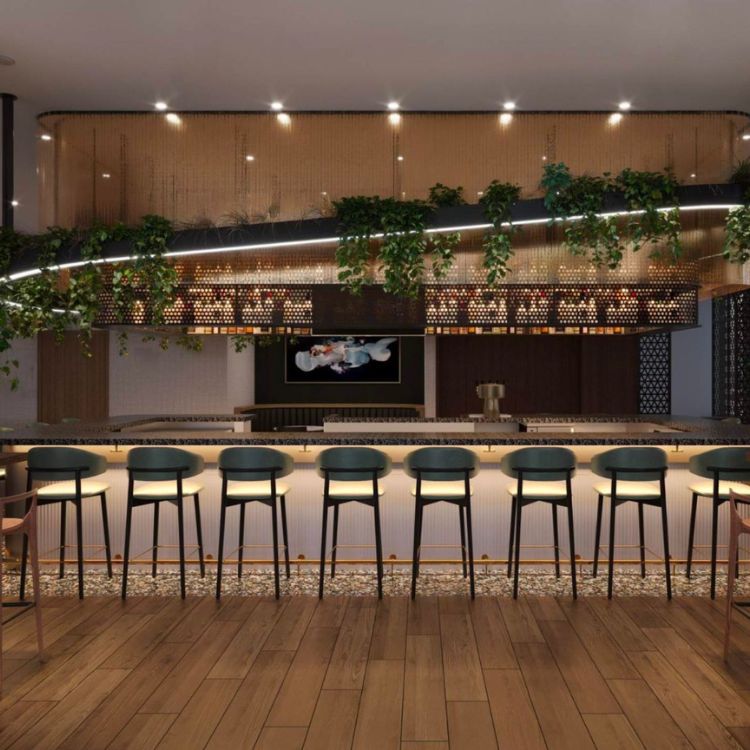 a bar with chairs and a tv