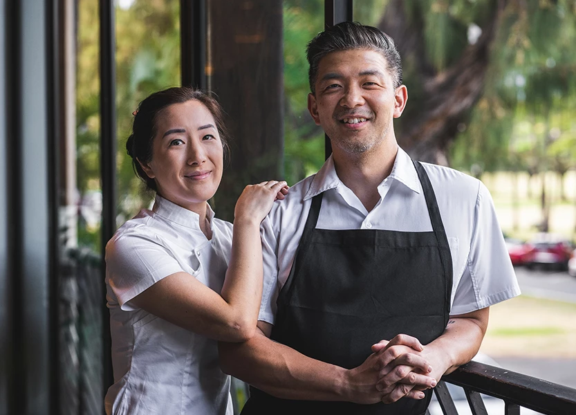 a man and woman standing next to each other