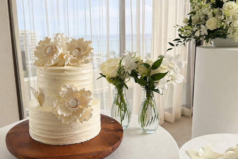 a white cake with flowers on top