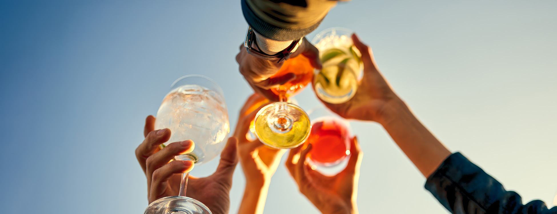 a group of people holding wine glasses